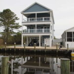 Teal Bliss Waterfront newly constructed home in Swann Keys exterior