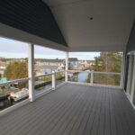 Teal Bliss Waterfront newly constructed home in Swann Keys third floor porch canal view